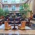 Euro Park Otel Istanbul atrium lounge with seating, tall windows, and indoor trees