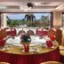 Tianfuyuan Resort Sanya banquet hall with round tables and tropical garden view