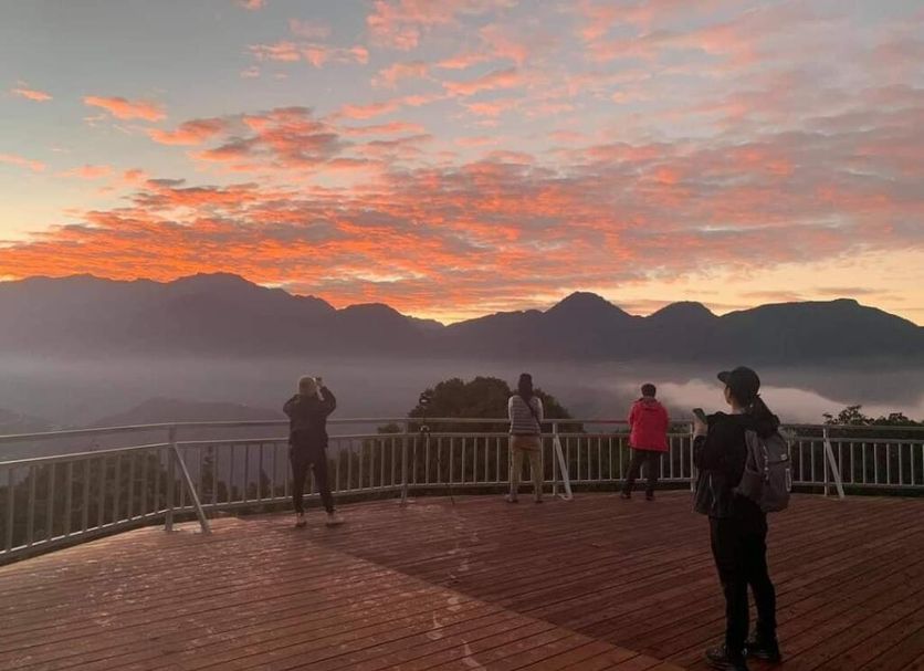 Cing Ging Star Home Stay in Ren-ai Township terrace with mountain sunrise and guests viewing the landscape