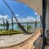 Vivanti Resort in Guatapé with a hammock on a balcony overlooking the lake and hills