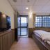 Guanwu Villa in Tai'an Township guest room with twin beds and mountain-view door