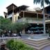 Guijo Suites Makati in Makati, exterior courtyard with steps, palm trees and outdoor dining