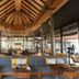 Apsara Beachfront Resort And Villa, Takua Pa: open-air lobby with high wooden سقence and seating