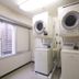 Shimonoseki Station West Washington Hotel Plaza laundry room with stacked washer and dryer units