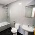Yarnfield Park Training And Conference Centre bathroom with bathtub, shower screen, sink and toilet in Stone