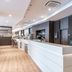 Hampton by Hilton Oswiecim lobby bar with long white counter and seating in Oświęcim