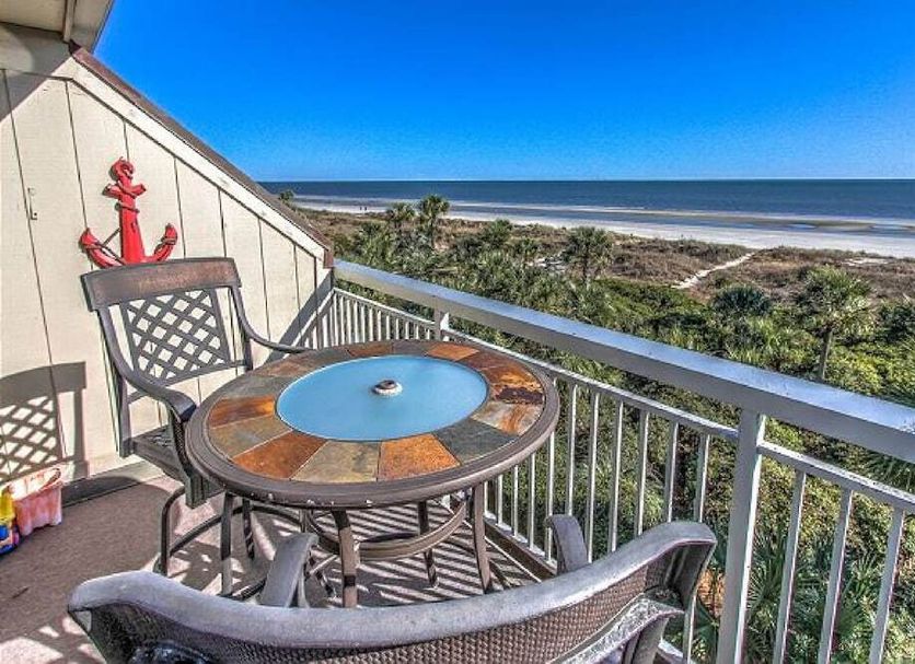 The Breakers Oceanfront 1 Bedroom Villas balcony with table and chairs overlooking Hilton Head Island beach