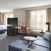 Residence Inn by Marriott Albany East Greenbush/Tech Valley suite with bed, sofa, TV and large windows