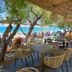 Great Greece Le Convivial Suites in Xylókastro: beachside dining area with sea views and lounge chairs