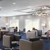 Courtyard by Marriott Cleveland Beachwood lobby with seating area and bar in Beachwood