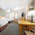 Best Western East Zion Thunderbird Lodge in Mount Carmel guest room with two beds, desk, TV and balcony doors