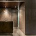Hotel Jal City Tsukuba lobby check-in desk with modern stone walls in Tsukuba