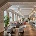 Grace La Margna St Moritz lounge with bar, arched windows and wood floors in St. Moritz