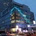 Urban Hostel Bangkok in Bangkok exterior at dusk with illuminated geometric facade and city backdrop
