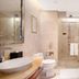 New Century Hotel Pudong Shanghai bathroom with glass shower, soaking tub, and vessel sink in Shanghai