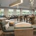 Residence Inn by Marriott Doral Mall Area breakfast area with seating, tables and chandeliers in Doral