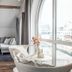 Quality Hotel Waterfront Alesund lounge with arched window, sofa and harbor view in Ålesund