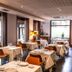 Hotel Rio Bidasoa restaurant in Hondarribia with set tables and bright window views