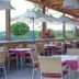 Das Eisenberg in Sankt Martin an der Raab terrace restaurant with umbrella tables and valley views