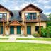 Ruttger's Bay Lake Resort in Deerwood with a two-story lodge, twin balconies, and teal doors