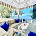 The Capitana Key West beachfront cabana with lounge seating and ocean view in Key West