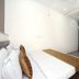 Oyo 8959 New Dk Palace Chandigarh room with double bed and wall-mounted TV