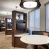 Courtyard by Marriott Johnson City lounge with round table, TV alcove and window seat