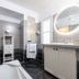Hotel Mas Djoliba, Antibes: modern bathroom with walk-in shower, vanity, round lit mirror, and bathtub
