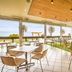Nightcap at Sandringham Hotel in Melbourne outdoor dining area with ocean-view windows and wicker chairs