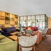 Leonardo Hotel Hannover Medical Park lounge in Hannover with colorful seating and floor-to-ceiling windows