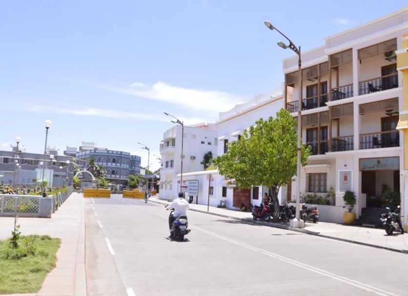 Cours Chabrol A Heritage Hotel By The Sea in Pondicherry, street view of white seaside hotel