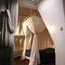 De Utrechtsche Dom, Gouda: cozy canopy bed room with skylight and draped curtains
