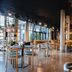 Hotel Guestapart Aarhus dining area with modern tables, chairs, and large windows