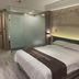 Anyi 158 Hotel Renming Park room in Chengdu with king bed and frosted glass bathroom