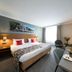 Bilderberg Grand Hotel Wientjes room in Zwolle with twin beds, desk, and window seating