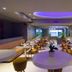Park Suites Hotel Luxury Boutique Hotel in Casablanca dining room with purple ceiling lighting and set tables