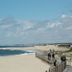 Roses Village Bed And Breakfast in Porto overlooking a sandy beach and ocean with a coastal walkway