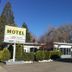 Diamond View Motel in Susanville exterior with sign, parking lot, and parked cars