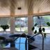 Amber's Inn & Suites in Wisconsin Dells indoor pool with large windows and potted plants