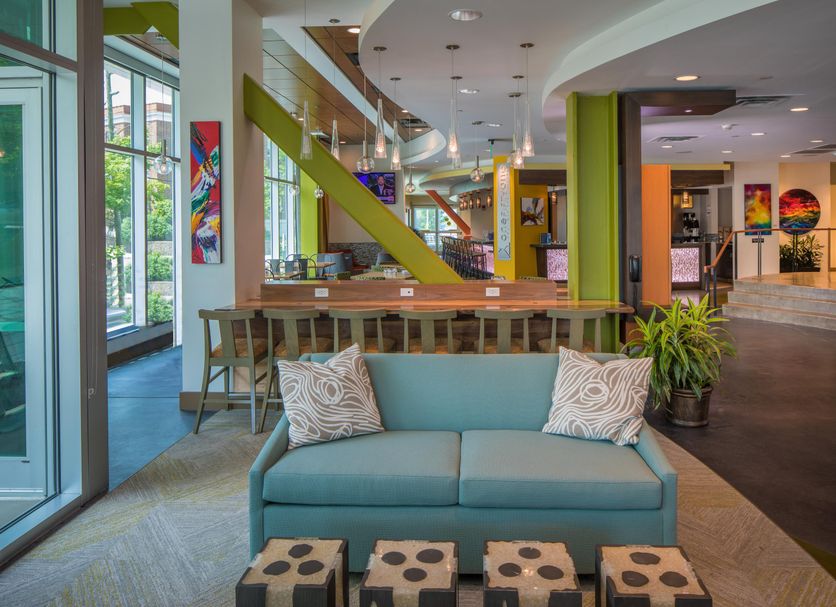 Hotel Indigo Asheville Downtown By IHG lobby seating area with sofa and colorful modern decor in Asheville