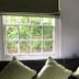 The White House in Bishop's Stortford room with window seat, green pillows and garden view
