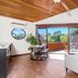 Aquarius Backpackers Resort, Byron Bay room with balcony doors, TV and tropical tree view