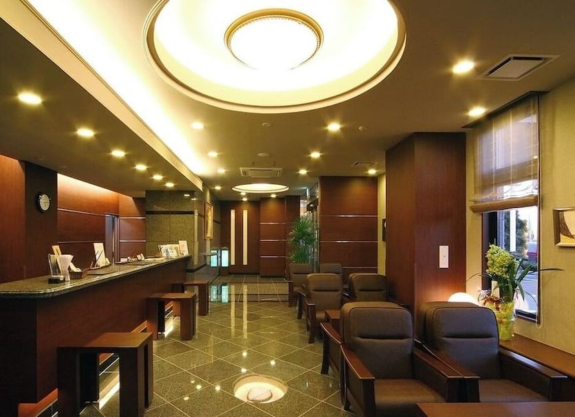 Hotel Route-Inn Utsunomiya Miyukicho lobby with seating and glossy floor in Utsunomiya