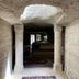 Seven Rock Cave Hotel in Göreme, cave-style hallway with carved stone columns and rugs