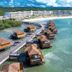 Princess Senses The Mangrove Resort - Adults Only in Green Island: overwater villas and pier above turquoise water