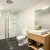 Nightcap at the Charles Hotel, Wollongong: modern bathroom with walk-in shower, toilet and vanity