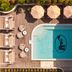 Basq House, Byron Bay rooftop pool with lounge chairs and umbrellas