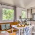 Camping Le Bois Fleuri, Argelès-sur-Mer: modern mobile home kitchen and dining area with sofa