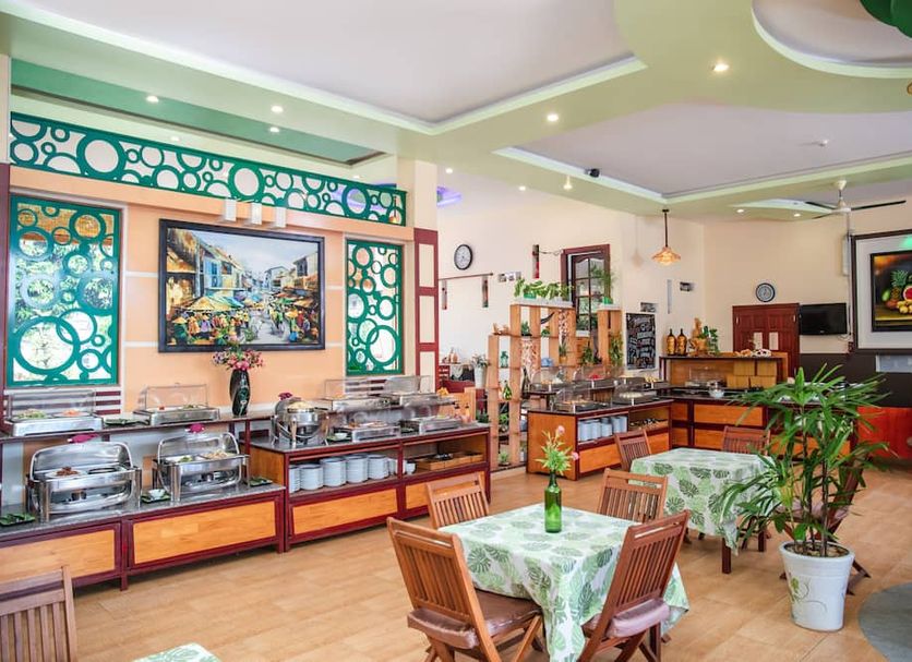 Bao Quynh Bungalow in Phan Thiet breakfast buffet dining room with tables and serving counters