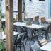 Dog and Partridge by Greene King Inns in Bury St. Edmunds outdoor courtyard dining area with tables and chairs